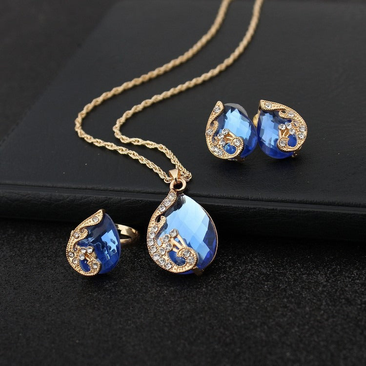 Pia – Schmuckset mit Halskette und Ohrringen in blauen und goldenen Kristallen